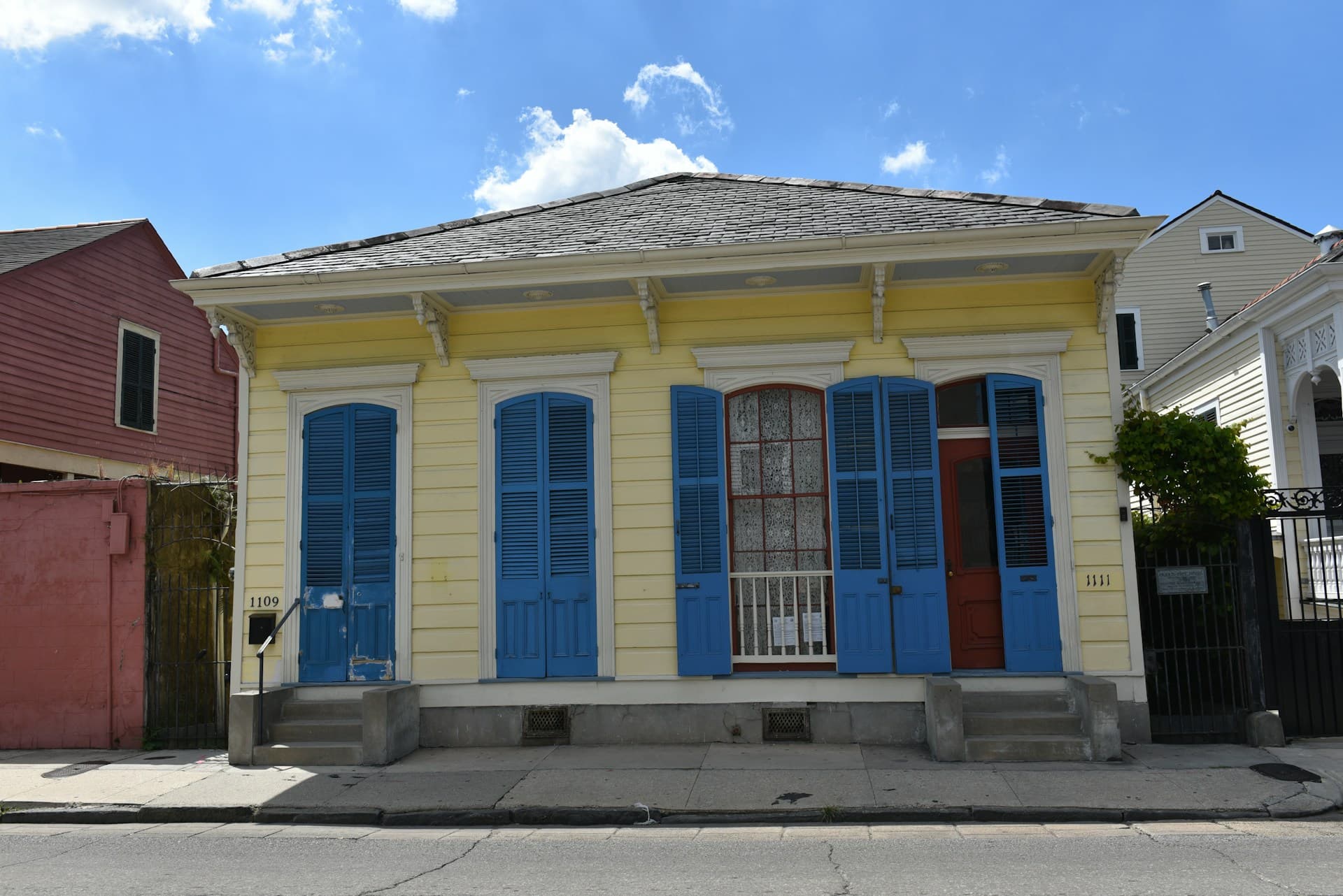 A brightly painted New Orleans shotgun house